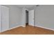 This bedroom offers a neutral color palette and a door to an adjacent room at 6820 Se 108Th St, Belleview, FL 34420