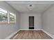 Bright, spacious bedroom featuring wood-look flooring and large windows for natural light at 6820 Se 108Th St, Belleview, FL 34420