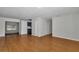 A bright living room boasts wood floors, neutral walls, and an open concept design at 6820 Se 108Th St, Belleview, FL 34420