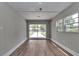 Room with sliding glass door and windows providing abundant natural light and views of the front yard at 6820 Se 108Th St, Belleview, FL 34420