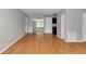 Bright living room featuring beautiful wood floors and a view into other rooms at 6820 Se 108Th St, Belleview, FL 34420