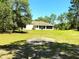 Large, verdant backyard ready for outdoor enjoyment and activities at 7134 Sw 129Th Terrace Road, Ocala, FL 34481