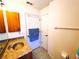 Bathroom with a unique basin sink and a storage cabinet for added functionality at 7134 Sw 129Th Terrace Road, Ocala, FL 34481