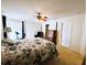 Spacious bedroom with ceiling fan, large window, and ample closet space at 7134 Sw 129Th Terrace Road, Ocala, FL 34481
