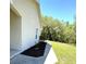 Side view of a cozy home featuring attractive landscaping and a well-kept lawn leading to a quiet street at 7134 Sw 129Th Terrace Road, Ocala, FL 34481