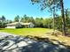 Beautiful home with a lush green yard and mature trees in a tranquil setting at 7134 Sw 129Th Terrace Road, Ocala, FL 34481