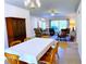 Open concept living room and dining area, furnished for comfort and style; great for entertaining at 7134 Sw 129Th Terrace Road, Ocala, FL 34481