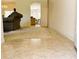 Open-concept living area with tile and carpet flooring offering a view into the dining area and kitchen at 7134 Sw 129Th Terrace Road, Ocala, FL 34481