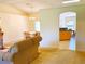 Spacious living area with seamless transition from living to dining and kitchen, perfect for entertaining at 7134 Sw 129Th Terrace Road, Ocala, FL 34481