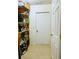 Walk-in pantry with abundant shelving offers ample storage for groceries and household items at 7134 Sw 129Th Terrace Road, Ocala, FL 34481