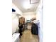 Spacious walk-in closet featuring built-in shelving and ample storage space at 7134 Sw 129Th Terrace Road, Ocala, FL 34481