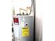 Close up of a modern water heater and its power usage guide at 7134 Sw 129Th Terrace Road, Ocala, FL 34481