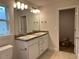 Bathroom featuring a double sink vanity and framed mirror at 74 Pine Trace Crse, Ocala, FL 34472
