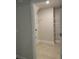 Spacious walk-in closet with built-in shelving and neutral tones offers ample storage space at 74 Pine Trace Crse, Ocala, FL 34472