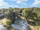 Aerial view of the property showcasing its lakefront location and surrounding greenery at 754 Se 167Th Court Rd, Silver Springs, FL 34488