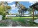 A serene backyard featuring mature trees and lake access to add privacy to the property at 754 Se 167Th Court Rd, Silver Springs, FL 34488