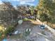 Expansive backyard featuring a trampoline, container, and lake access for outdoor enjoyment at 754 Se 167Th Court Rd, Silver Springs, FL 34488