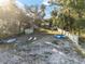 Spacious backyard with a container, trampoline, and lounge chairs near the lake at 754 Se 167Th Court Rd, Silver Springs, FL 34488