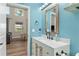 Bathroom featuring a modern vanity with wood accents and lots of natural light at 754 Se 167Th Court Rd, Silver Springs, FL 34488