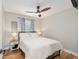 Comfortable bedroom with a ceiling fan and a window at 754 Se 167Th Court Rd, Silver Springs, FL 34488