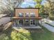 Modern home with wood and green siding, a covered patio, and a well-maintained lawn at 754 Se 167Th Court Rd, Silver Springs, FL 34488