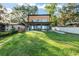 Modern exterior of a home with a covered patio and large backyard at 754 Se 167Th Court Rd, Silver Springs, FL 34488