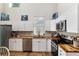 Spacious kitchen with stainless steel appliances, white cabinets, and wood countertops at 754 Se 167Th Court Rd, Silver Springs, FL 34488