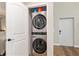 Laundry closet featuring a stacked washer and dryer at 754 Se 167Th Court Rd, Silver Springs, FL 34488