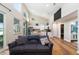 Bright open-concept space with modern kitchen, living room and access to bathroom and bedrooms at 754 Se 167Th Court Rd, Silver Springs, FL 34488