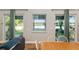 Combination living and dining area features wood floors, lake view and access to the backyard at 754 Se 167Th Court Rd, Silver Springs, FL 34488