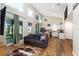 Bright, open-concept living room and kitchen featuring wood floors, high ceilings and lake views at 754 Se 167Th Court Rd, Silver Springs, FL 34488