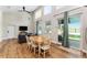 Open living room with high ceilings, lots of natural light, and wood-look floors at 754 Se 167Th Court Rd, Silver Springs, FL 34488