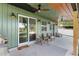 Covered patio complete with ceiling fan, recessed lights, a grill and ample seating area at 754 Se 167Th Court Rd, Silver Springs, FL 34488