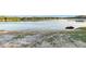 A personal watercraft sits on the shore of this waterfront property at 754 Se 167Th Court Rd, Silver Springs, FL 34488
