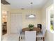 Bright breakfast nook with white tile and a view to the outside at 8524 Sw 90Th Ln # B, Ocala, FL 34481