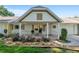Charming home featuring a cozy front porch, well-kept landscaping, and inviting curb appeal at 8524 Sw 90Th Ln # B, Ocala, FL 34481