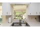 Bright kitchen with a double basin sink and a large window with backyard views at 8524 Sw 90Th Ln # B, Ocala, FL 34481