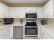 Fully equipped kitchen features modern appliances and ample counter space at 8524 Sw 90Th Ln # B, Ocala, FL 34481