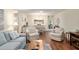 Open-concept living and dining area with modern décor and beautiful hardwood floors at 8524 Sw 90Th Ln # B, Ocala, FL 34481