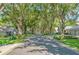 A tree-lined street showcases the homes in a peaceful neighborhood, promising a serene living environment at 8524 Sw 90Th Ln # B, Ocala, FL 34481