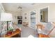 Cozy sunroom with comfortable seating, natural light, and easy access to adjacent rooms at 8524 Sw 90Th Ln # B, Ocala, FL 34481