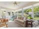 Bright sunroom with large windows, comfortable seating, and a ceiling fan to create a relaxed atmosphere at 8524 Sw 90Th Ln # B, Ocala, FL 34481