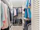 Walk-in closet featuring custom shelving, rods, and storage solutions for organized wardrobe management at 8524 Sw 90Th Ln # B, Ocala, FL 34481