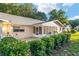 The backyard shows lush landscaping, a screened-in porch, and a charming picket fence at 8681 Sw 93Rd Pl # B, Ocala, FL 34481