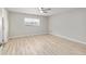 Bedroom with laminate flooring, a window, and neutral paint at 8681 Sw 93Rd Pl # B, Ocala, FL 34481