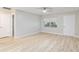 Bright bedroom with neutral paint, ceiling fan, LVP floors, and a closet at 8681 Sw 93Rd Pl # B, Ocala, FL 34481