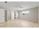 Spacious bedroom with laminate flooring, ceiling fan, and a large window at 8681 Sw 93Rd Pl # B, Ocala, FL 34481