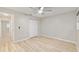 Neutral bedroom with light-colored floors, ceiling fan, closet, and natural light at 8681 Sw 93Rd Pl # B, Ocala, FL 34481
