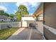 Home exterior featuring a patio, white picket fence, and landscaping at 8681 Sw 93Rd Pl # B, Ocala, FL 34481