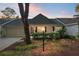 Charming single story home with a well-manicured front yard and welcoming entrance at sunset at 8681 Sw 93Rd Pl # B, Ocala, FL 34481